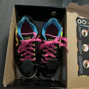 Worn only twice! Youth Black and Pink Heelys Shoes still with original box.